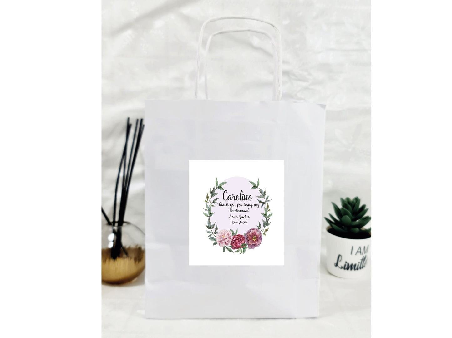 Personalised luxury paper gift bag with custom name and message sticker for celebrations