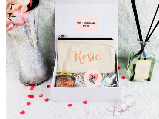 Personalised happy birthday gift box filled with cosmetic purse, pocket mirror, bath salts and sweeties