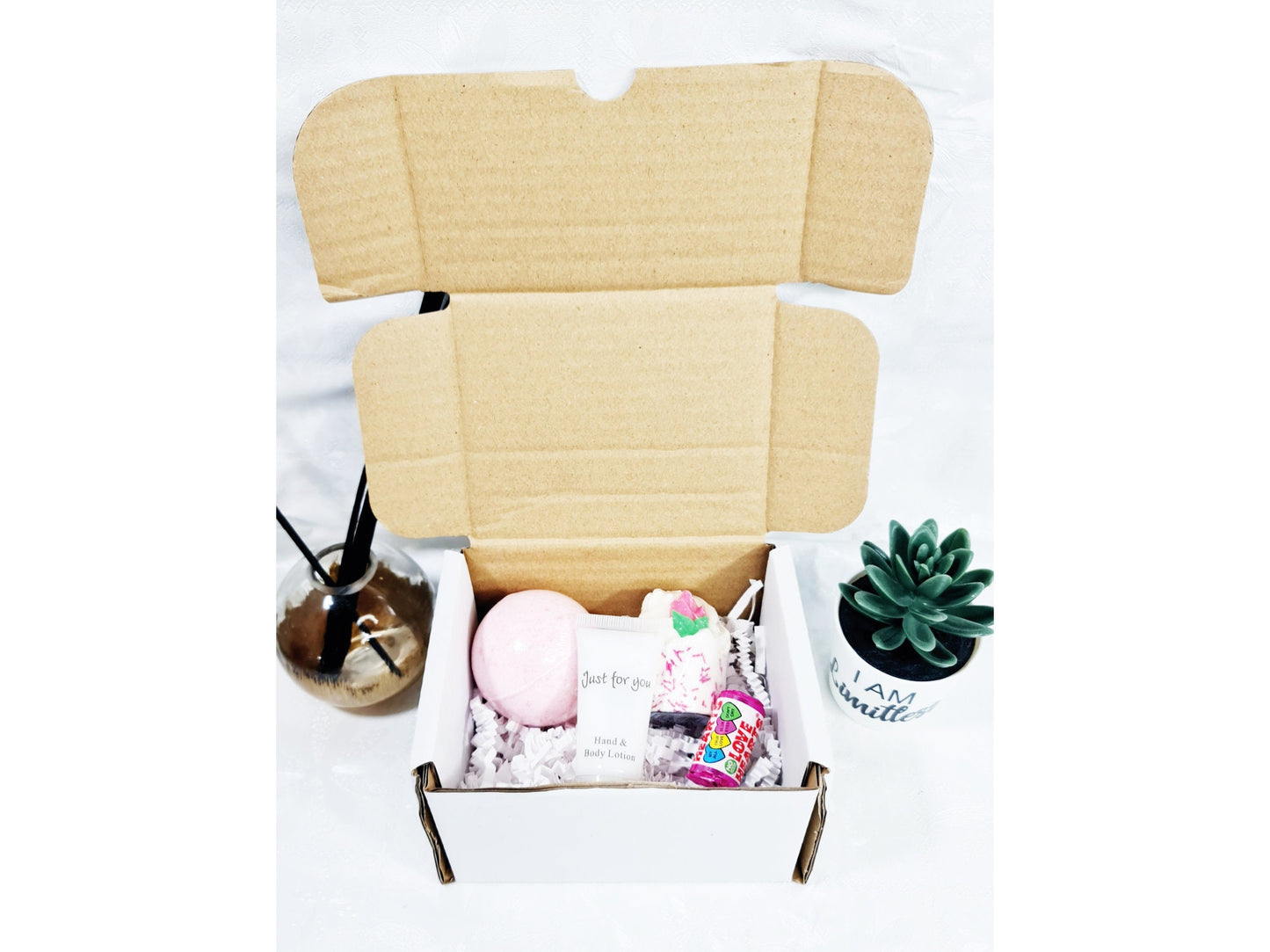 Contents of personalised bridesmaid proposal box showing bath melt, hand cream and Haribo sweet
