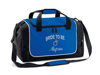 Personalised bride-to-be overnight bag in red and black with gold ring detail and custom text