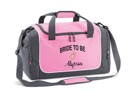 Personalised bride-to-be weekend bag in pink and grey with custom name and gold glitter ring design