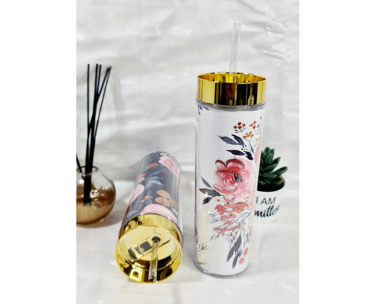 Personalised floral tumblers in multiple colours showing name options