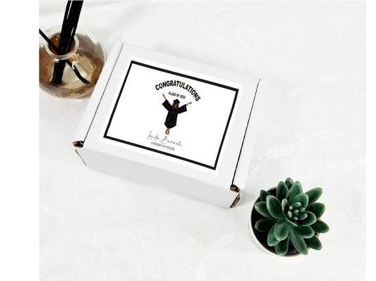 Personalised graduation gift box with custom illustration of graduate and treats inside